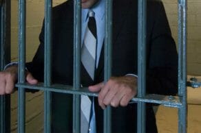Man behind bars.