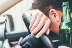 beer in hand passed out behind wheel of car | dwi attorney