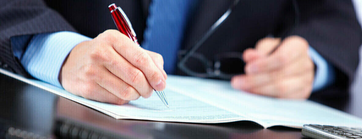 Person writing a document
